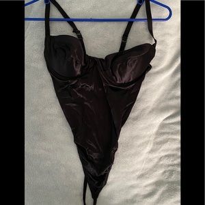 Victoria Secrets black satiny thong teddy.